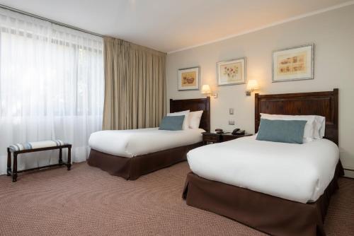 Ένα ή περισσότερα κρεβάτια σε δωμάτιο στο Teclados Hotel