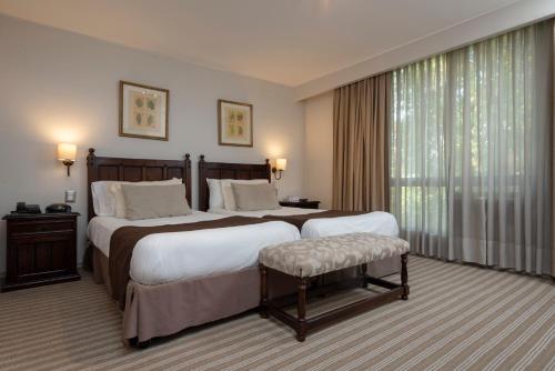 Llit o llits en una habitació de Teclados Hotel