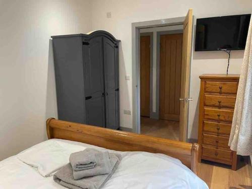 Ein Bett oder Betten in einem Zimmer der Unterkunft Hendrix’s cottage