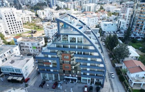 a building with a bridge over a city at Nurel Shark Residence in Kérynia