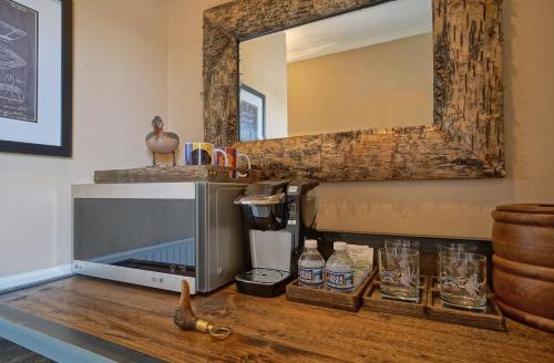 a counter with a coffee maker and a mirror at Decoys in Suffolk