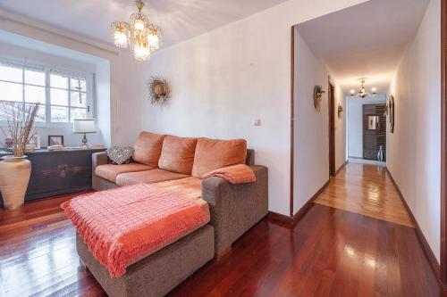 a living room with a couch and a table at YourHouse A Casa Dos Cregos in Fonteita