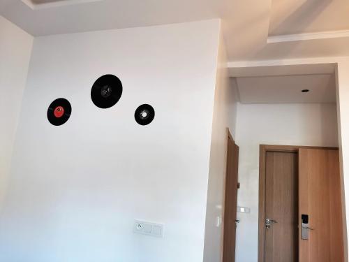 a group of records on the wall of a room at Edy's STD03 in Imsouane