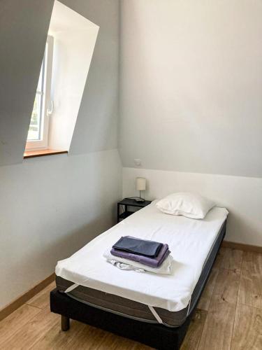 Postel nebo postele na pokoji v ubytování Gîte du Pavement