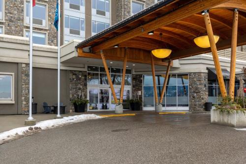 a building with awning in front of a building at Four Points by Sheraton Kelowna Airport in Kelowna