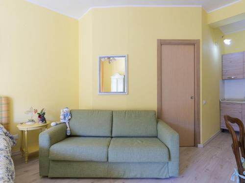 a living room with a couch and a table at Apartment Valentina by Interhome in Diano Castello