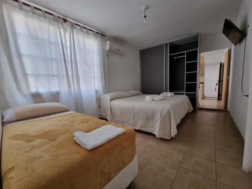 Una cama o camas en una habitación de ParSur alquileres temporales Catamarca