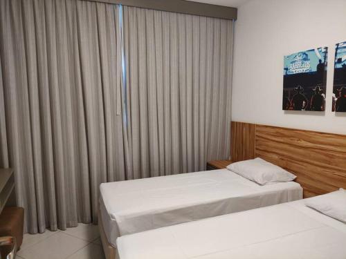 Postel nebo postele na pokoji v ubytování Condomínio Barretos Thermas Park Apto 514