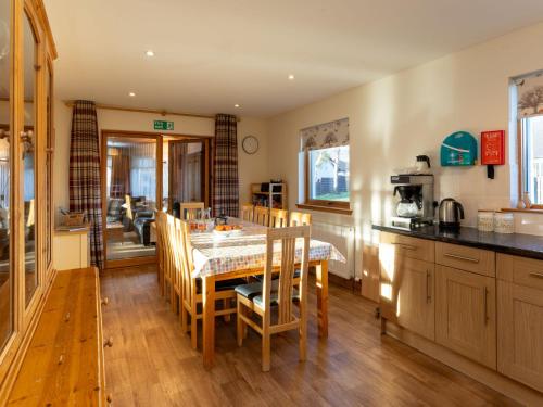 a kitchen and dining room with a table and chairs at Villa Craigmore Lodge by Interhome in Aviemore