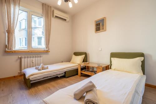 Voodi või voodid majutusasutuse City Lodge in the Heart of Sofia toas