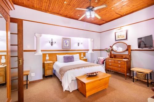 Ένα ή περισσότερα κρεβάτια σε δωμάτιο στο Kleine Eden Guesthouse