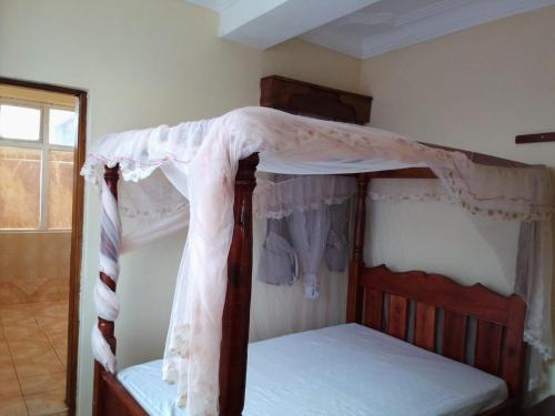 a bedroom with two bunk beds in a room at Dreams lodge in Busia