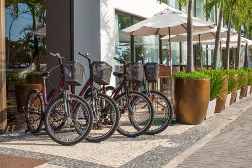 a row of bikes parked in front of a building at Lifestyle Laghetto Collection in Rio de Janeiro
