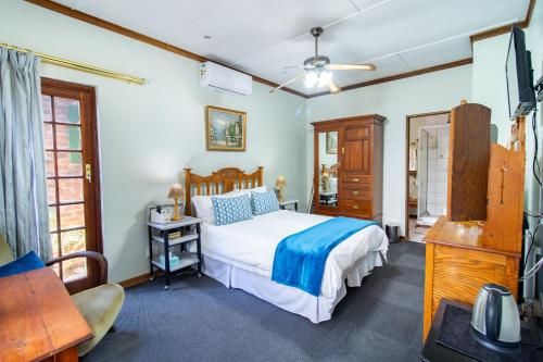 Ένα ή περισσότερα κρεβάτια σε δωμάτιο στο Kleine Eden Guesthouse