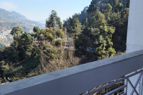 a view of a mountain from a bridge at Hillside 3BHK with PanoramicView in Solan