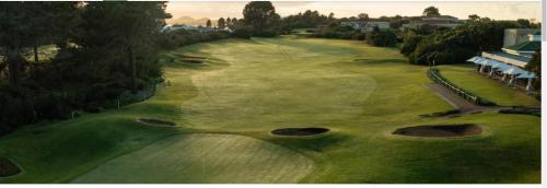 an overhead view of a golf course with many holes at Loerie Lodge in Keurboomstrand