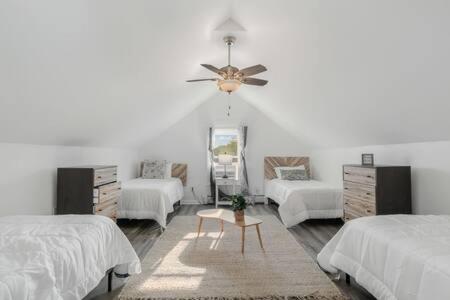 a bedroom with two beds and a ceiling fan at New Near Beach Casino Dunes Zoo& Restaurants in Michigan City