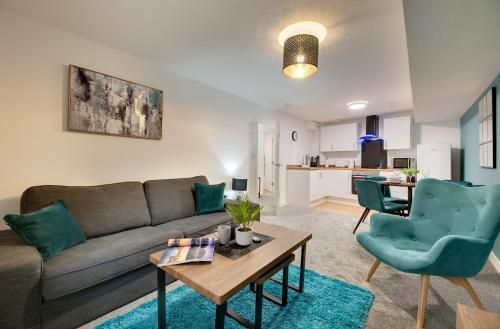 a living room with a couch and a table at Charltons Bonds 2A Stylish Staycation City Break in Newcastle upon Tyne
