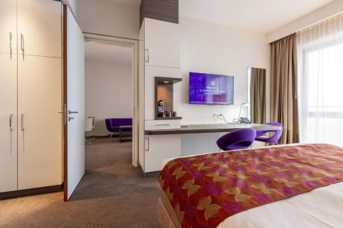 Postel nebo postele na pokoji v ubytování Hotel Lumen Zwolle