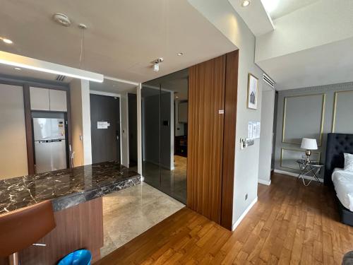 a living room with a counter top in a room at Anggun KL MY in Kuala Lumpur