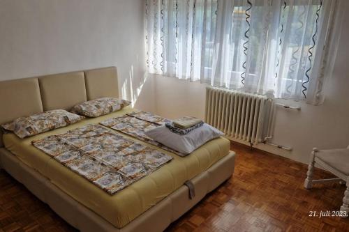 a bedroom with a bed in a room at Apartman Cowabunga in Sarajevo