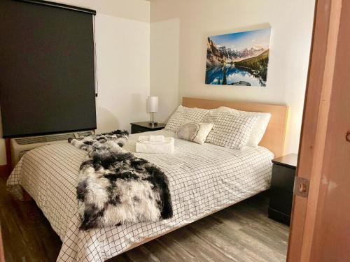 Ένα ή περισσότερα κρεβάτια σε δωμάτιο στο Condo du Bonheur