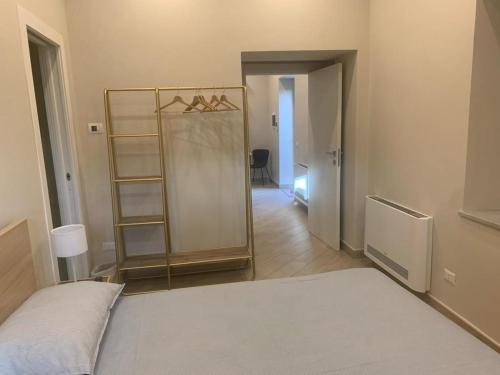 a room with a bed and a mirror in it at DON PEPPE ROOMS : Villaggio Green in SantʼAngelo in Formis
