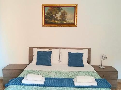 Un pat sau paturi într-o cameră la Amico Del Sole