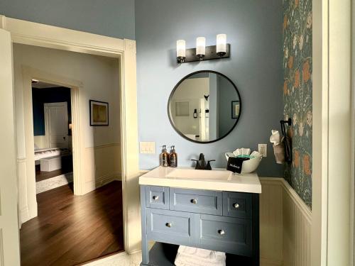 a bathroom with a sink and a mirror at Garden on Capital-Bourbon & Horse Country in Frankfort