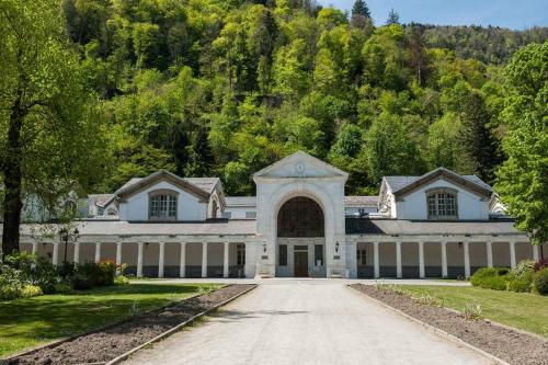 a large white house with a driveway at LE SQUARE in Luchon