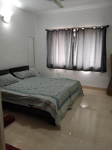Кровать или кровати в номере Coconut Grove Residence CGR