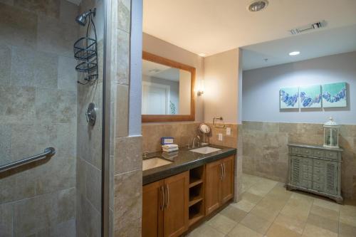 a bathroom with a shower and a sink at Ocean Club 1501 in Biloxi