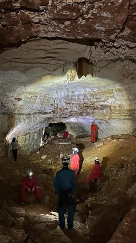 a group of people standing in a cave at GITE LA GROTTE VALLEE in Aoûtouss