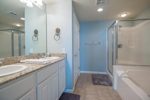 a bathroom with two sinks and a shower at Legacy I 407 in Gulfport