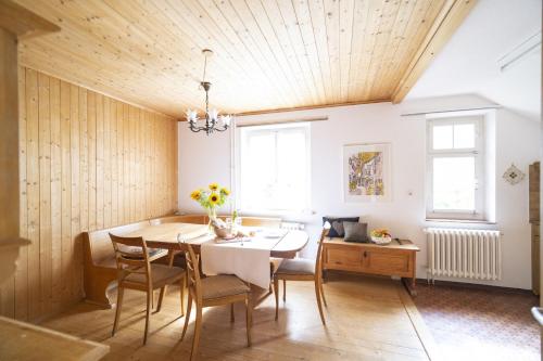 a dining room with a table and chairs at Chasa Muglinér 115 in Scuol
