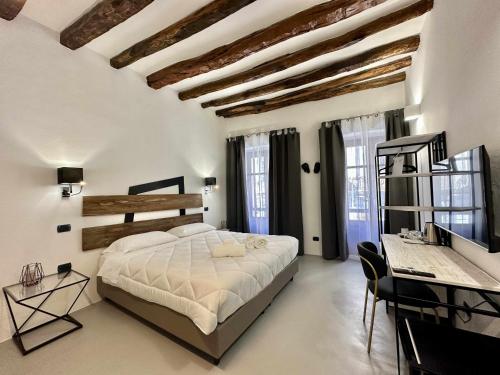 Posteľ alebo postele v izbe v ubytovaní C&O Savoia Deluxe Rooms