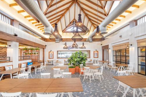 a dining room with tables and chairs in a building at Bahia Principe Grand El Portillo - All Inclusive in Las Terrenas