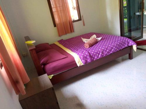 Un ou plusieurs lits dans un hébergement de l'établissement Chalisa Bukit House Lanta