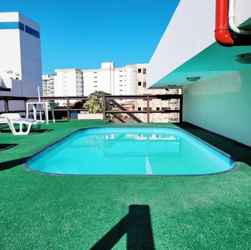 a swimming pool on the roof of a building at Orla de Araruama in Araruama