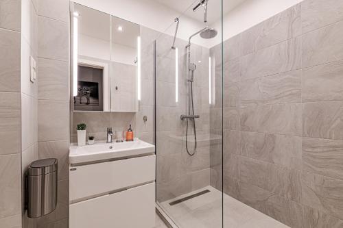 a bathroom with a shower and a sink at Luxury Tropical Apartment at Budapest in Budapest