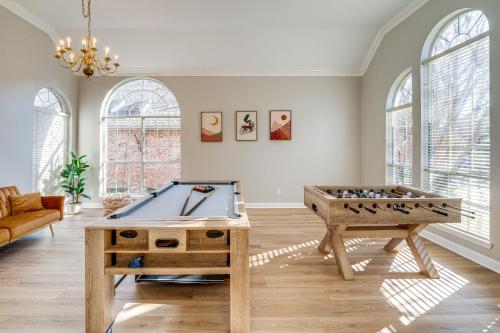 a living room with a ping pong table at Private Patio and Game Room Home in Richardson! in Richardson