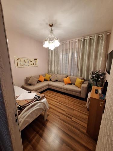 a living room with a couch and a table at CozyFlat in the middle of Tirana in Tirana