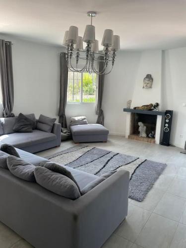 a living room with a couch and a fireplace at Casa Beavan in Alicante