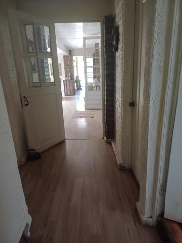 an empty hallway with a door leading to a room at Casaantivero boutique,casa de huéspedes in San Fernando