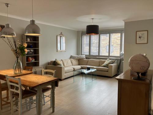 a living room with a couch and a table at The Heart of Rye in Rye