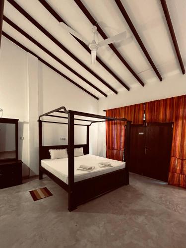 a bedroom with a bunk bed in a room at Green Corridor - Ahangama in Ahangama