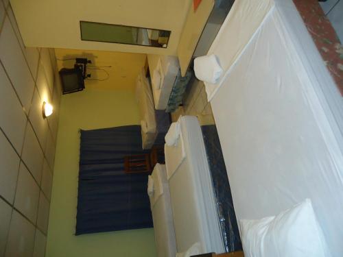 Posteľ alebo postele v izbe v ubytovaní CENTRO YAYABO