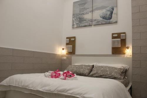 Ένα ή περισσότερα κρεβάτια σε δωμάτιο στο Il Biscottino rooms