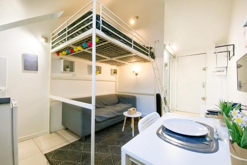 a small apartment with a bunk bed in a room at The Champo studio Near the city centre #B2 in Grenoble