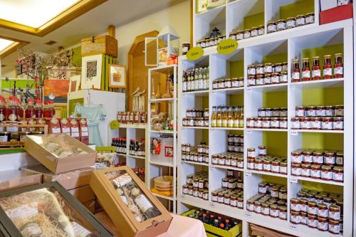 a store filled with shelves filled with products at Hirschenwirt in Schönbühel an der Donau